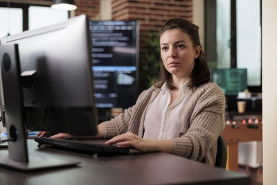 Portrait of young businesswoman working at office