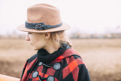 Close-up of woman wearing hat