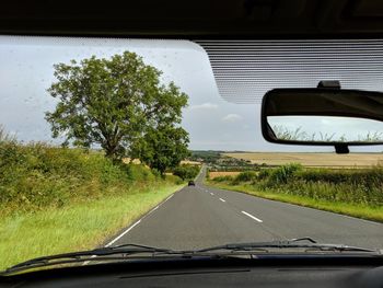 Road seen through car windshield