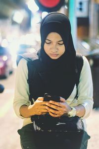 Young woman using mobile phone