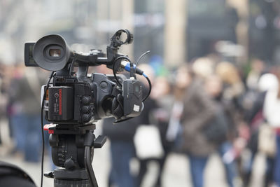 Television camera with people in background