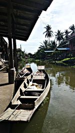 Calm lake with buildings in background