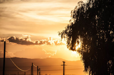 Scenic view of silhouette mountains against sky during sunset