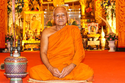 Portrait of a smiling statue at temple