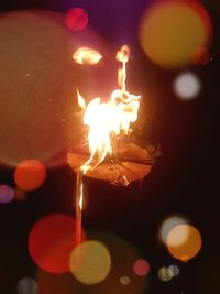 Close-up of burning candles