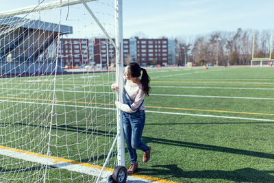 Woman with soccer goal