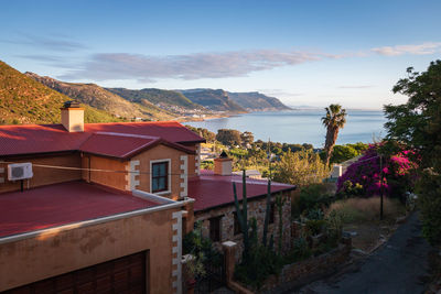 Scenic view over houses in simons town to false bay and kalk bay in the morning