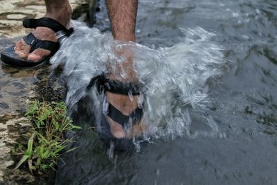 Low section of man on water