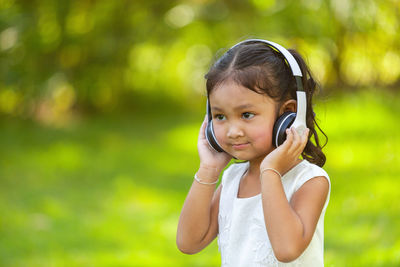 Portrait of cute girl standing outdoors