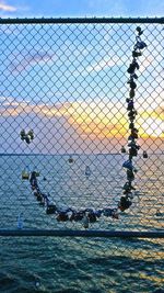 Chainlink fence at sunset