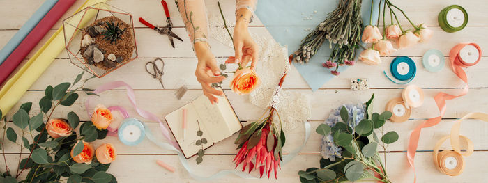 High angle view of decoration hanging on table against wall