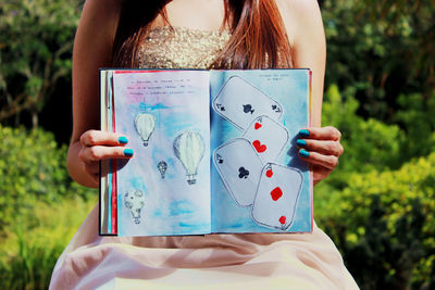 Close-up of hand holding cigarette
