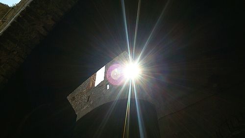 Low angle view of man against bright sun