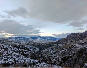 Scenic view of snowcapped mountains against sky