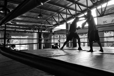 Boxers fighting in boxing ring