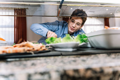 Portrait of woman preparing food