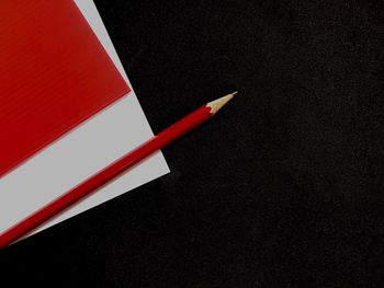 High angle view of pen on table against black background