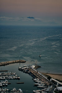 High angle view of harbor by sea against sky