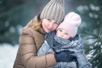 Portrait of young woman wearing warm clothes