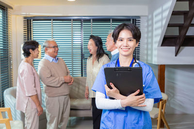 Business colleagues using digital tablet in office