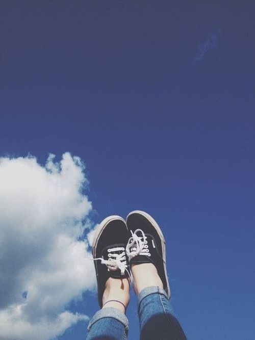 low section, personal perspective, person, shoe, lifestyles, low angle view, blue, standing, sky, men, leisure activity, part of, copy space, unrecognizable person, human foot, outdoors, footwear