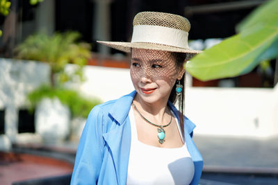 Portrait of smiling woman wearing hat