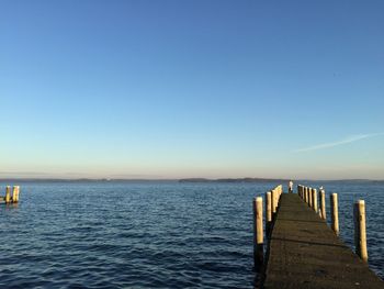 Jetty leading to calm sea