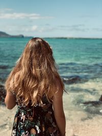 Rear view of woman looking at sea