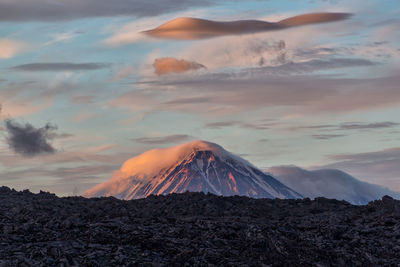 Panoramic view of volcanic landscape against sky during sunset