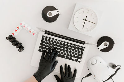 Directly above shot of objects against white background