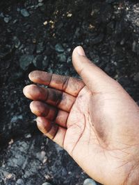 Cropped image of dirty hand