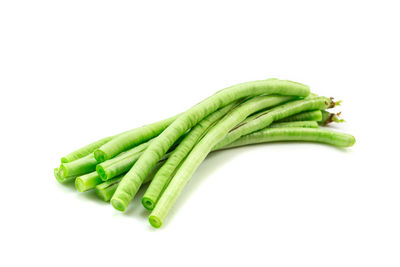 Close-up of green pepper against white background