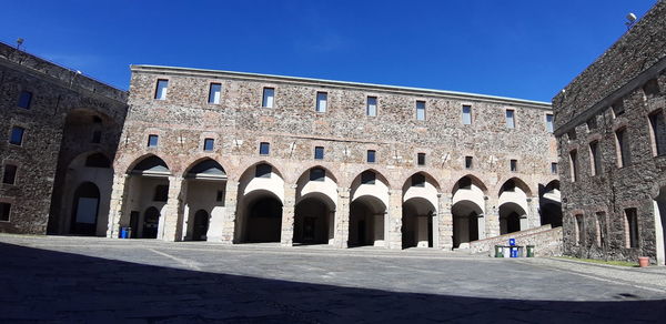 Facade of historic building against blue sky