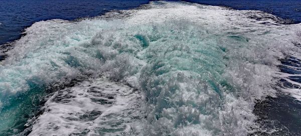 High angle view of water splashing in sea