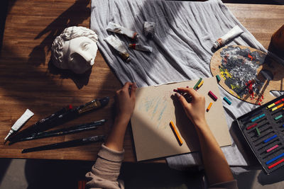 High angle view of woman using digital tablet