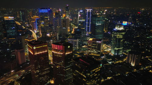 Aerial view of illuminated cityscape at night