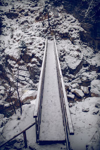 High angle view of snow covered railroad tracks