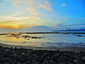 Scenic view of sea at sunset