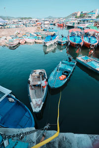 High angle view of boats moored at harbor