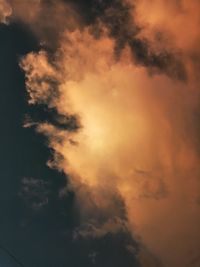 Low angle view of dramatic sky during sunset