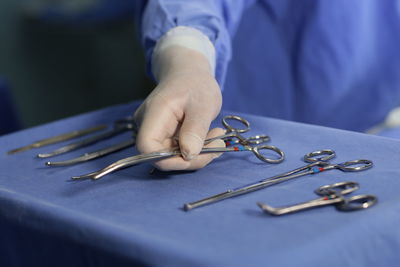 Midsection of man working on table