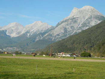 Scenic view of landscape and mountains against sky