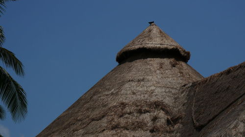 Low angle view of building against clear blue sky