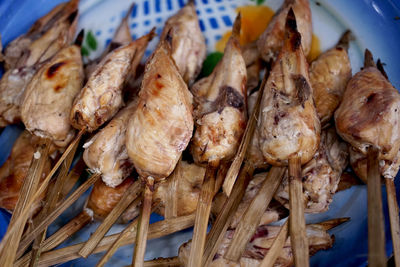 High angle view of meat on barbecue