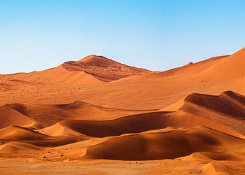 Scenic view of desert against clear sky