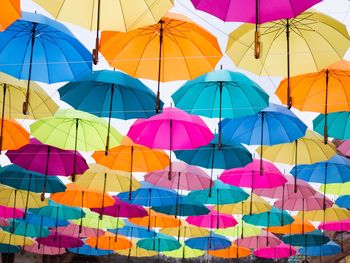 Low angle view of multi colored umbrellas