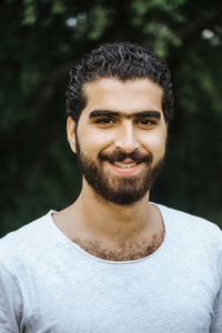 Close-up portrait of smiling young man