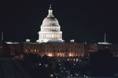 Buildings in city at night