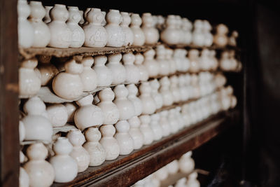 White pottery arranged on shelf