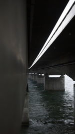 View of bridge over river at night